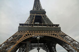 Fototapeta Paryż - The lower part of Eiffel tower, Paris, France