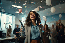 Woman Celebrating Her Promotion With Colleagues At The Office