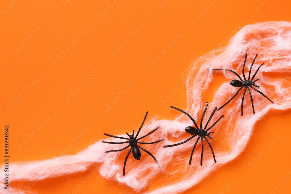 Cobweb with spiders for Halloween party on orange background