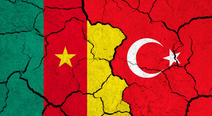 Flags of Cameroon and Turkey on cracked surface - politics, relationship concept