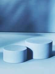 Aufkleber - Pair of blue cylinders, empty pedestals and shaded wall in background . 3d computer graphic template of displaying place for your products. Blank template.