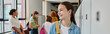 © LIGHTFIELD STUDIOS - banner, happy teenage girl smiling in school hallway, cultural diversity, teacher and kids, blur