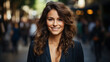 © Eduardo - Young happy pretty smiling professional business woman, happy confident positive female entrepreneur standing outdoor on street, looking at camera