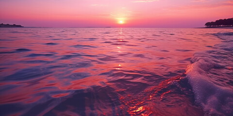 Wall Mural - pink sunset at sea ,sunlight blurred light on sea water wave