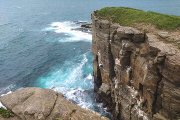 top view of ocean and rock texture. Aerial view of sea and fantastic Rocky coast.