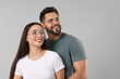 © New Africa - Beautiful couple wearing glasses on light gray background, space for text