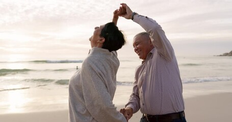 Canvas Print - Senior couple, beach and dancing outdoor at sunset with love, care and quality time on travel. Happy man and woman together at ocean to celebrate retirement holiday, fun energy or vacation in nature