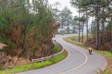 A Pass Road With People And Motorbikes Moving At Lac Duong, Dalat, Lamdong, Vietnam