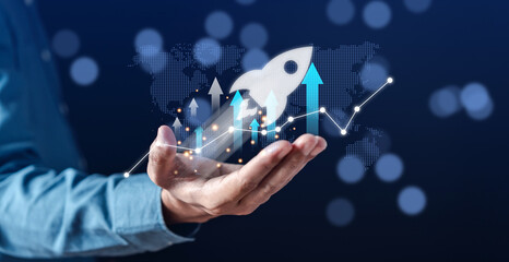 Leinwandbilder - Businessman hold virtual rocket launch investment growth, planning and starting corporate business start up aiming objective value development leadership and customer target group.