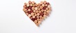 A high-quality photograph displaying a heart made of wine corks on a white background, taken from