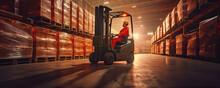 Worker With Yellow Helmet Driving Forklift In Warehouse.