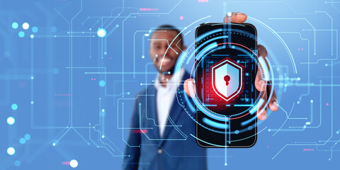 Poster - African man showing smartphone with cyber security shield icon
