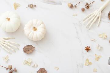 Sticker - white halloween pumpkins with decor on marble background