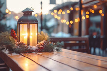 Lit Lantern As A Decoration Of A Wooden Table On Christmas Market. Decorated And Illuminated Outdoor Tables Of A Restaurant Of Cafe. Snowy Winter Day.