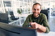 © Valerii Apetroaiei - A man working as a call center operator in an office