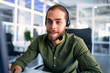 © Valerii Apetroaiei - A man working as a call center operator in an office