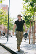© Stanislav - Happy Ukrainian soldier returning from the war in his vacation walking on street.