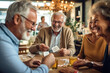 © Goffkein - Satisfied joyful happy old people friends spending time together playing poker