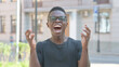 © stockbakers - Outdoor Portrait of Angry Young African Man Screaming in Frustration