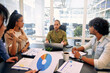© Valerii Apetroaiei - A group of young freelancers working in a coworking space