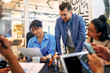© Valerii Apetroaiei - A group of young freelancers working in a coworking space