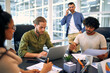© Valerii Apetroaiei - A group of young freelancers working in a coworking space