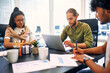 © Valerii Apetroaiei - A group of young freelancers working in a coworking space