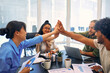 © Valerii Apetroaiei - A group of young freelancers working in a coworking space