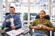 © Valerii Apetroaiei - A group of young freelancers working in a coworking space