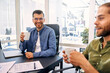 © Valerii Apetroaiei - A group of young freelancers working in a coworking space