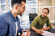© Valerii Apetroaiei - A group of young freelancers working in a coworking space