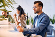 © Valerii Apetroaiei - A group of young freelancers working in a coworking space
