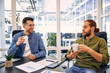 © Valerii Apetroaiei - A group of young freelancers working in a coworking space