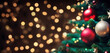 © Francescozano - Christmas tree with baubles and bokeh blurred lights on background. Copy space. Greetings card.