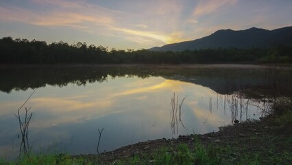 Wall Mural - morning view of the misty reservoir at the top of the water, surrounded by mountains. beautiful sky.
