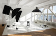 © Volodymyr_sh - Professional lighting equipment, ligts, stands, soft boxeson a white huge big cyclorama in modern photo studio with a big daylight windows.