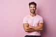© dinastya - Portrait of smiling young man of athletic build in sports uniform isolated on pink background. Creative banner of fitness center with copy space.