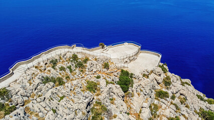 Wall Mural - Aerial view of the Mirador de El Colomer (El Colomer viewpoint) on top of a sea cliff of Cape Formentor on the northeastern coast of Mallorca in the Balearic Islands, Spain