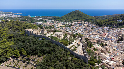 Wall Mural - Castle of Capdepera on the Balearic island of Majorca in the Mediterranean Sea - Medieval walled fortress built on a slope covered with maquis