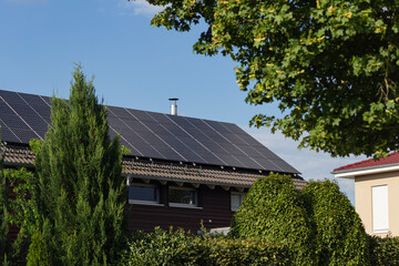 Poster - new building with solar panel on rooftop and garden green tree bush