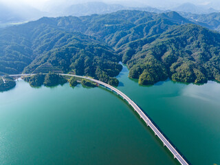 Wall Mural - Large reservoir and road bridge overlooking the mountains