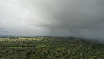 Wall Mural - rain storm over tropical landscape