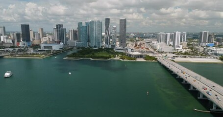 Wall Mural - Aerial towards Miami downtown skyscrapers and bridge with cars