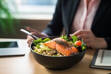 Female Office Worker In White Shirt Eating For Lunch Trendy Dish Poke Bowl With Rice Or Quinoa And Salmon In A White Bowl. Take-away Meal In The Lunch Break.