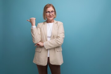 Wall Mural - business 50s adult woman with a bob hairstyle in a trendy jacket on a bright background with copy space