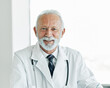 doctor senior laptop man medical hospital care health clinic elderly mature caucasian male happy healthcare glasses office confident medicine occupation