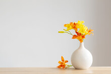 Summer Flowers In White Modern Vase On Wooden Shelf