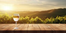 Empty Wood Table Top With A Glass Of Wine On Blurred Vineyard Landscape Background, For Display Or Montage Your Products.