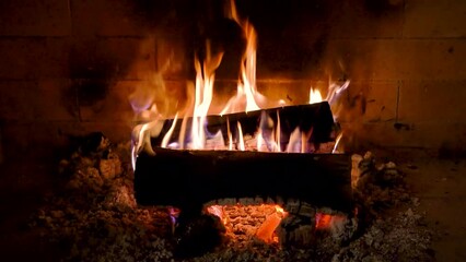 Poster - Closeup footage of wood burning in a fireplace and returning into ashes