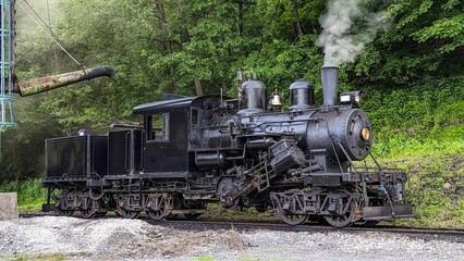 Canvas Print - Side View of a Climax Antique Steam Locomotive Warming Up for a Days Work